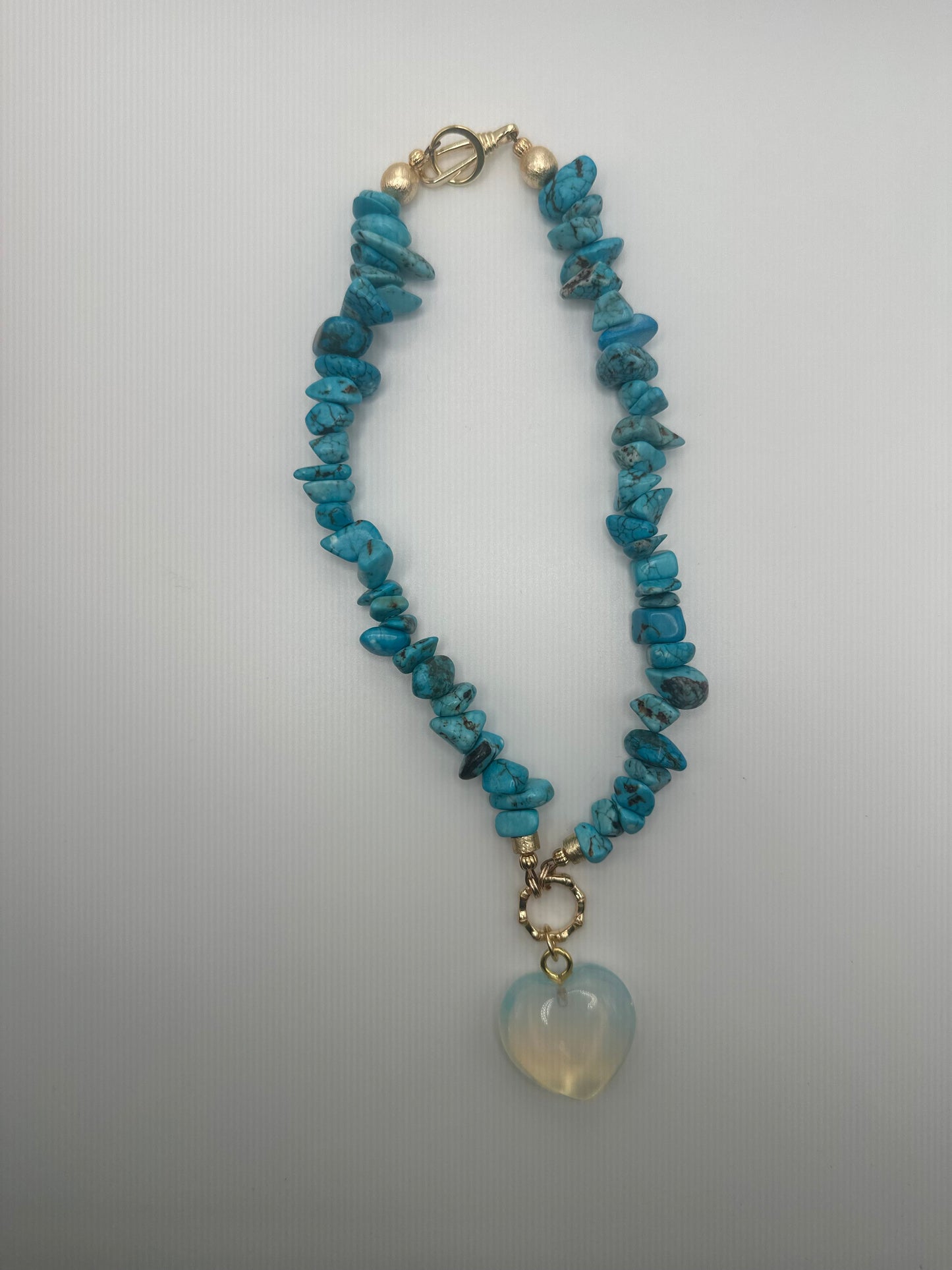 The Quarry: turquoise stones with translucent heart pendant