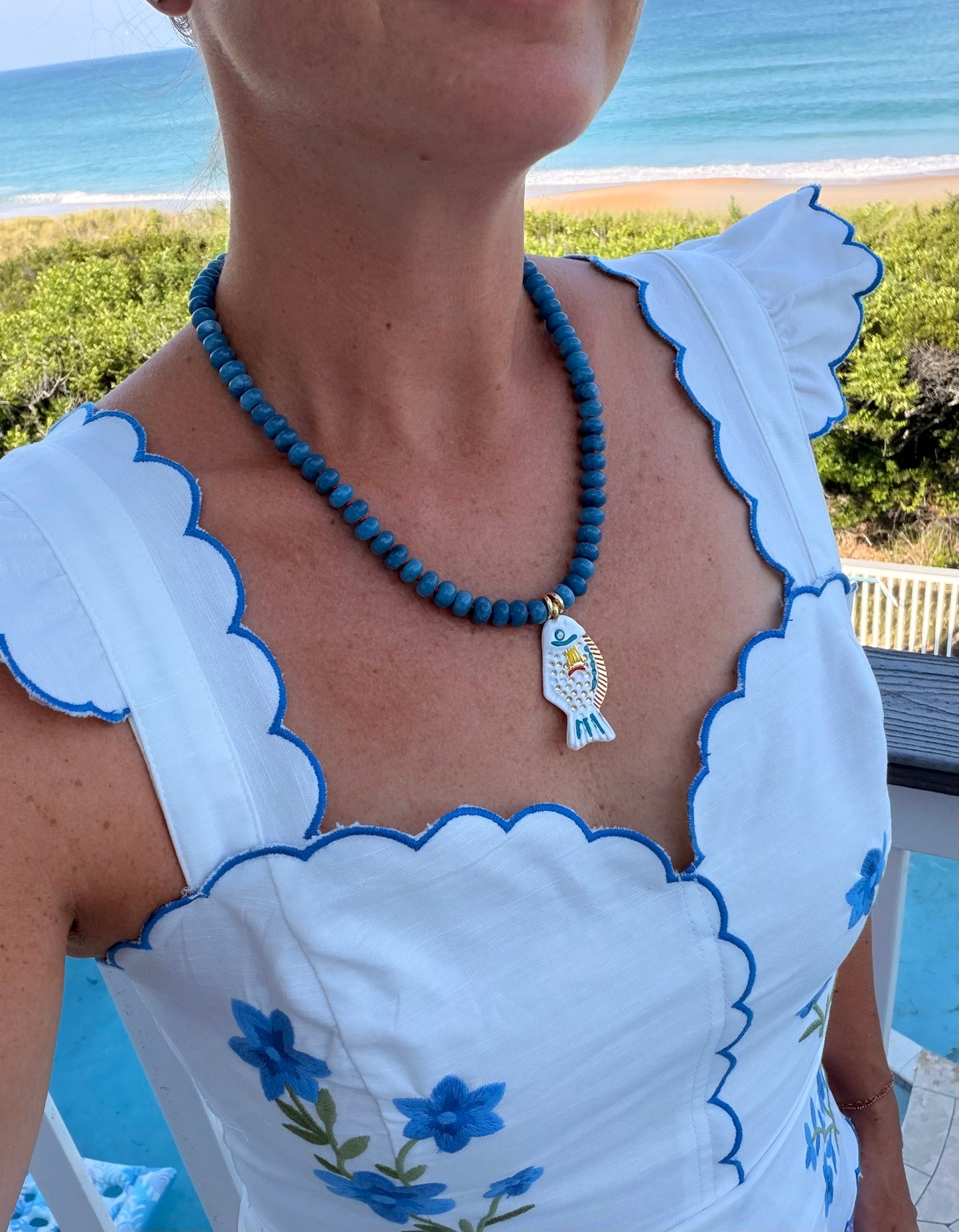 Fish: blue beads with white fish pendant