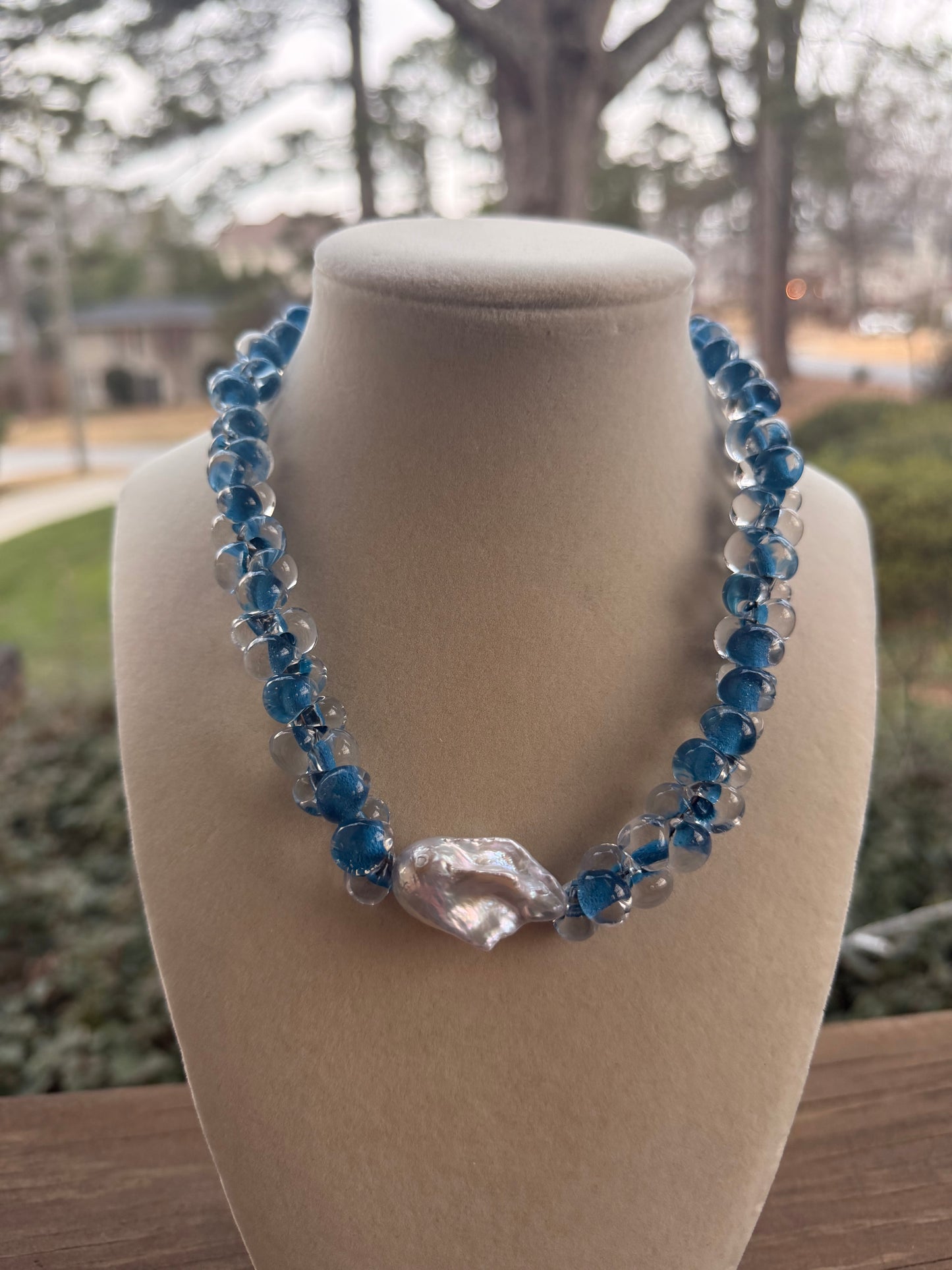 Radiance: blue and clear hand blown glass beads with a baroque pearl