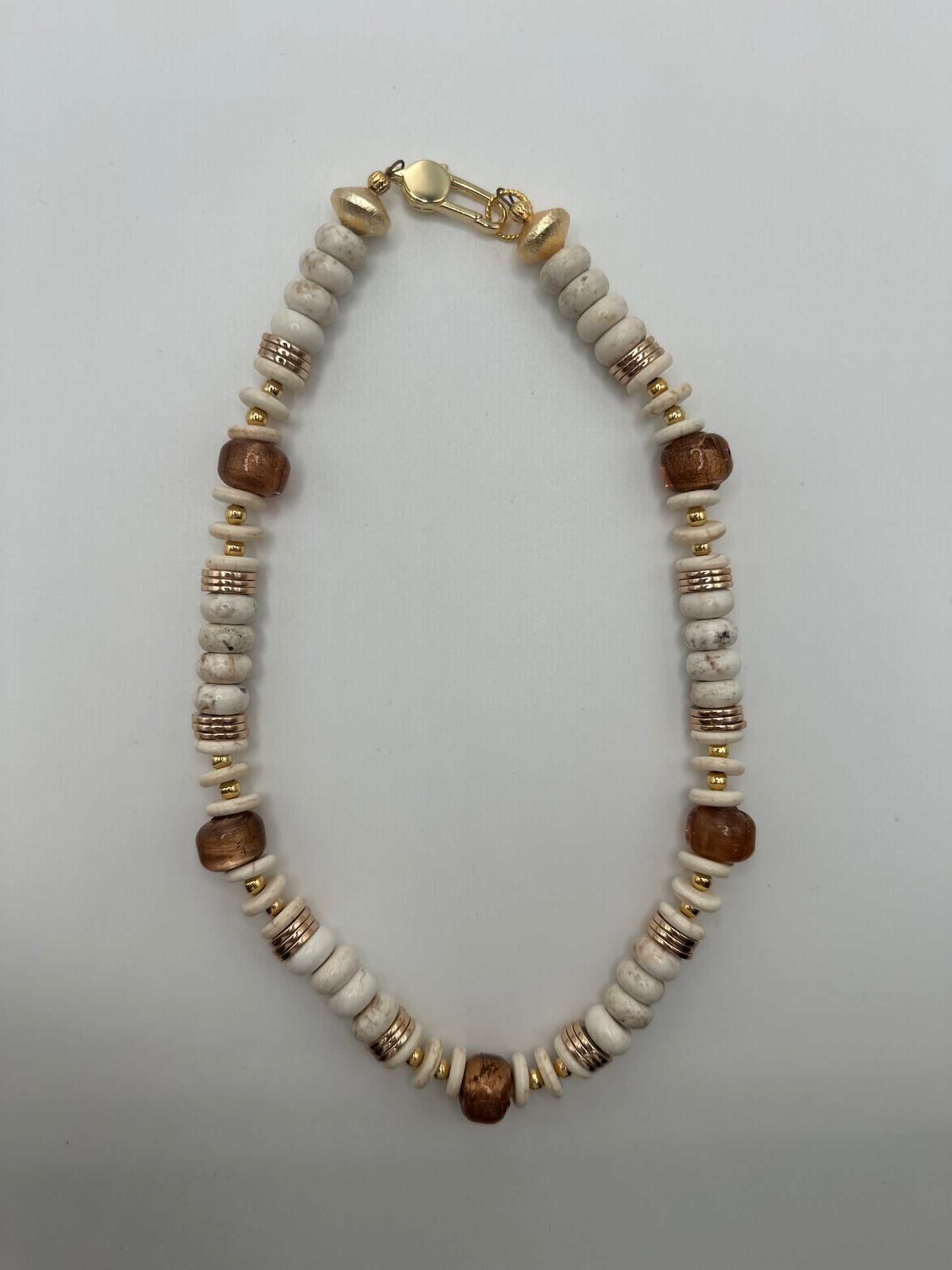 Meridian: creams, gold, and bronze