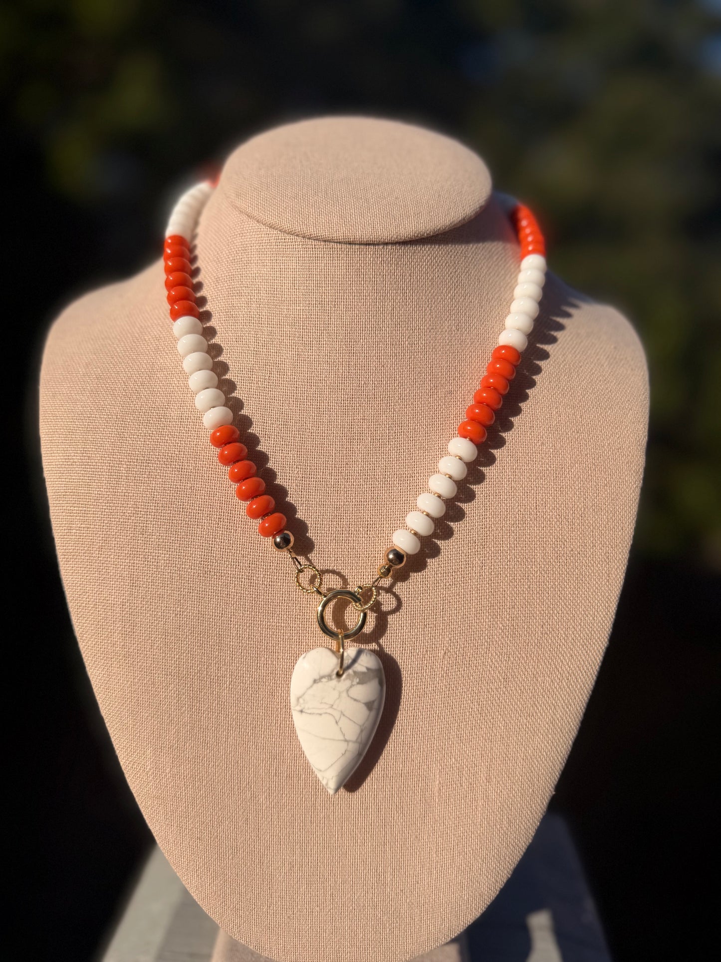 Game Day🏈: Orange and white with a white heart pendant