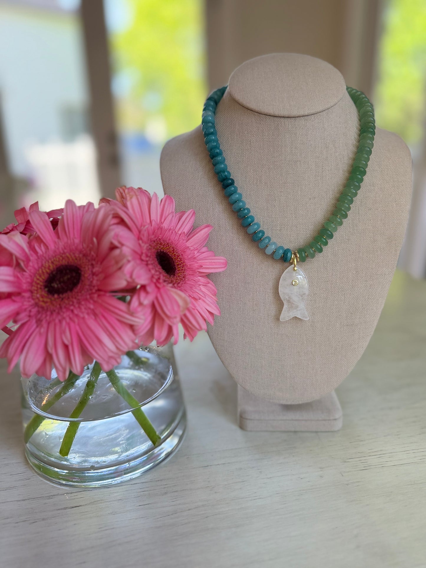 Flock: half blue half green with a fish charm