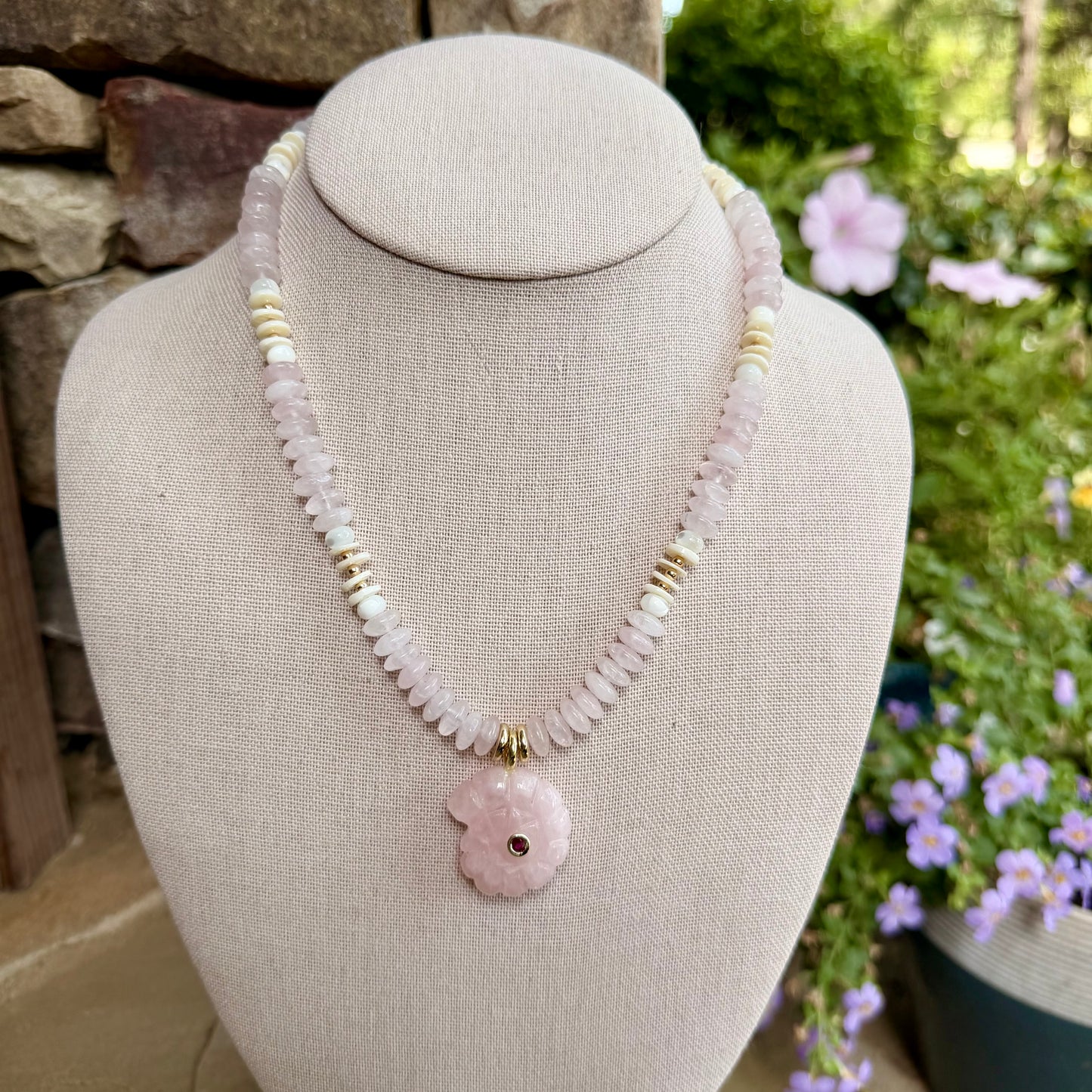 Beachy: light pink saucer beads with shells and a light pink nautilus shell pendant