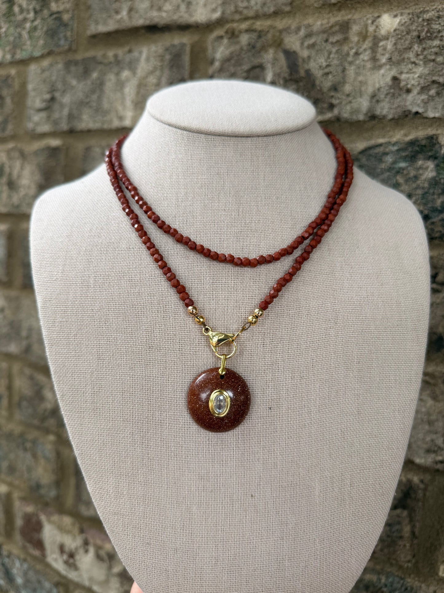 Double wrap: dark rust red with a sparkly pendant