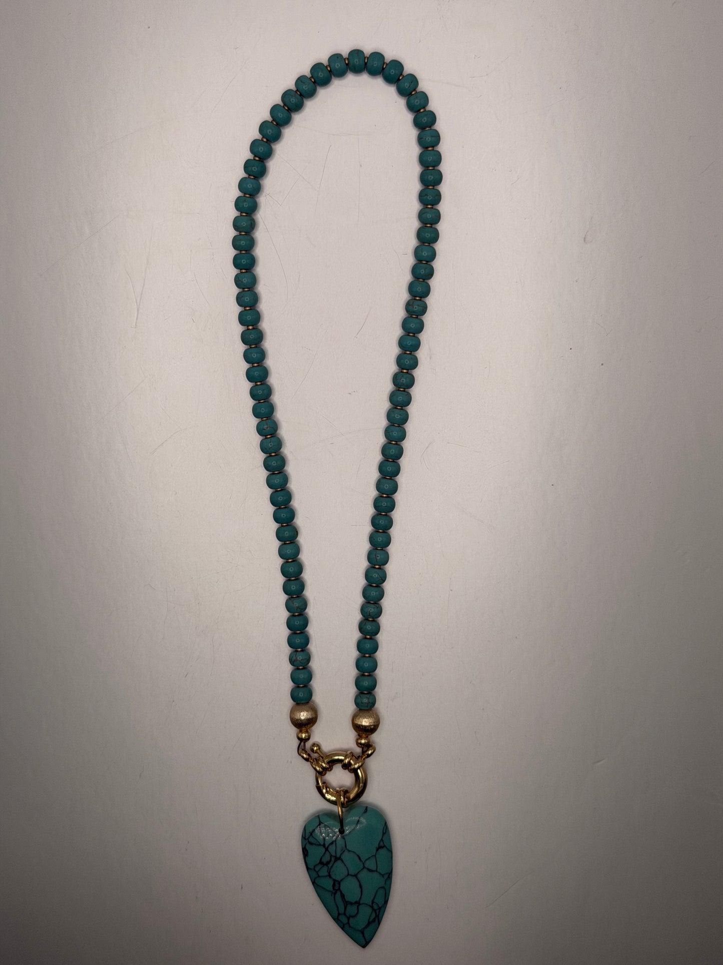 Flock: turquoise with heart pendant
