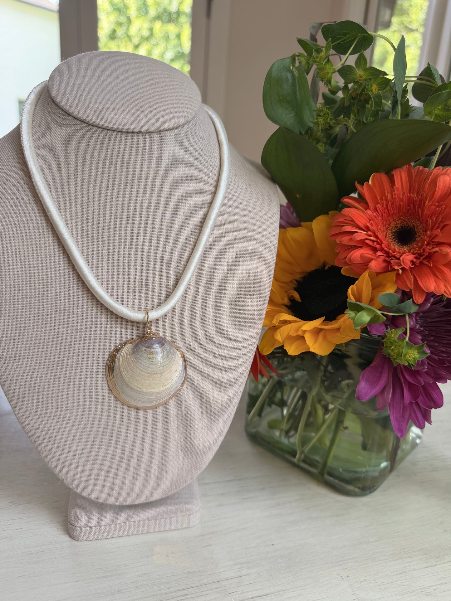 Cream cord with shell pendant