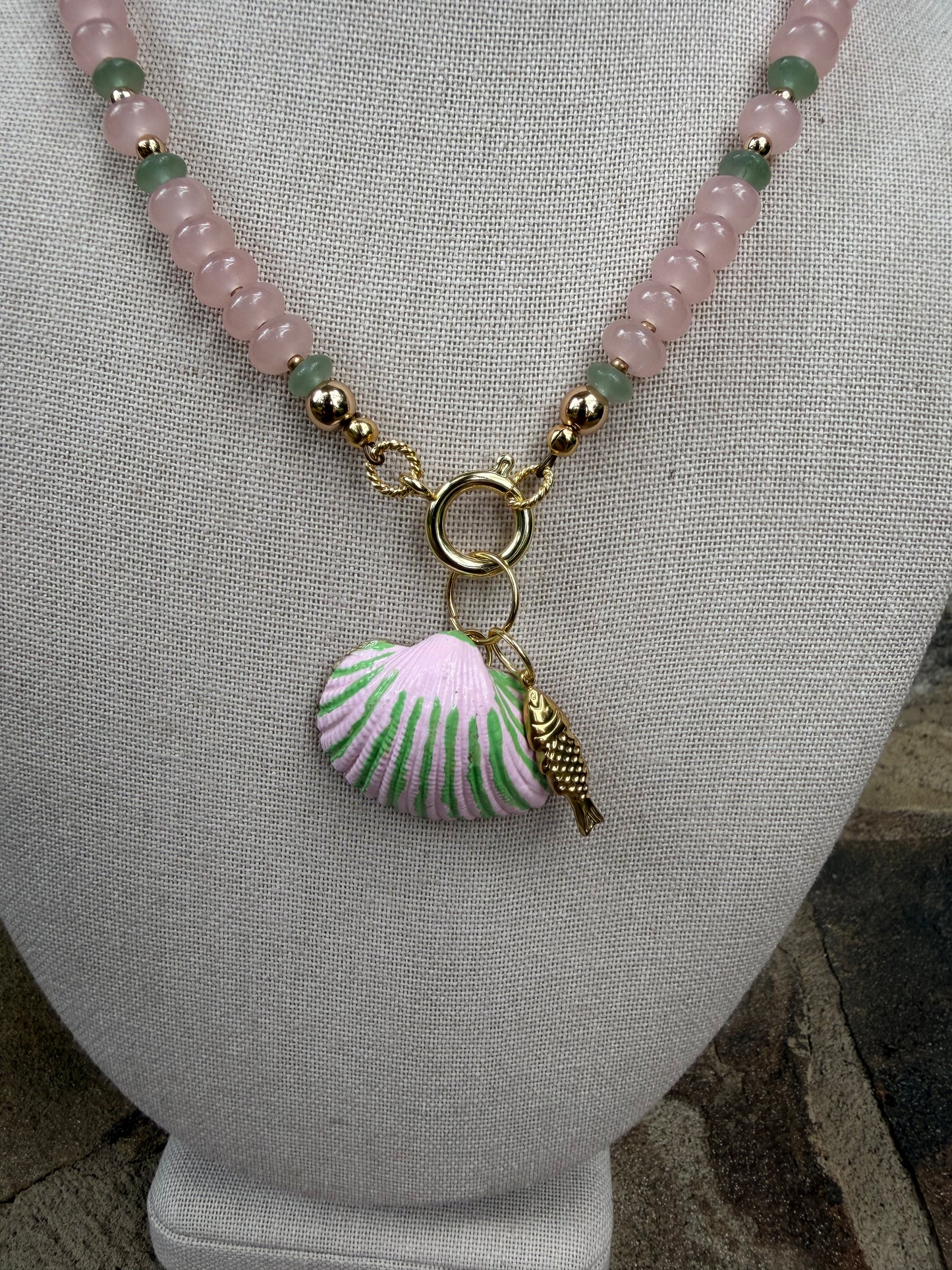 Beachy: pink and green, with a matching hand painted shell and fish charm