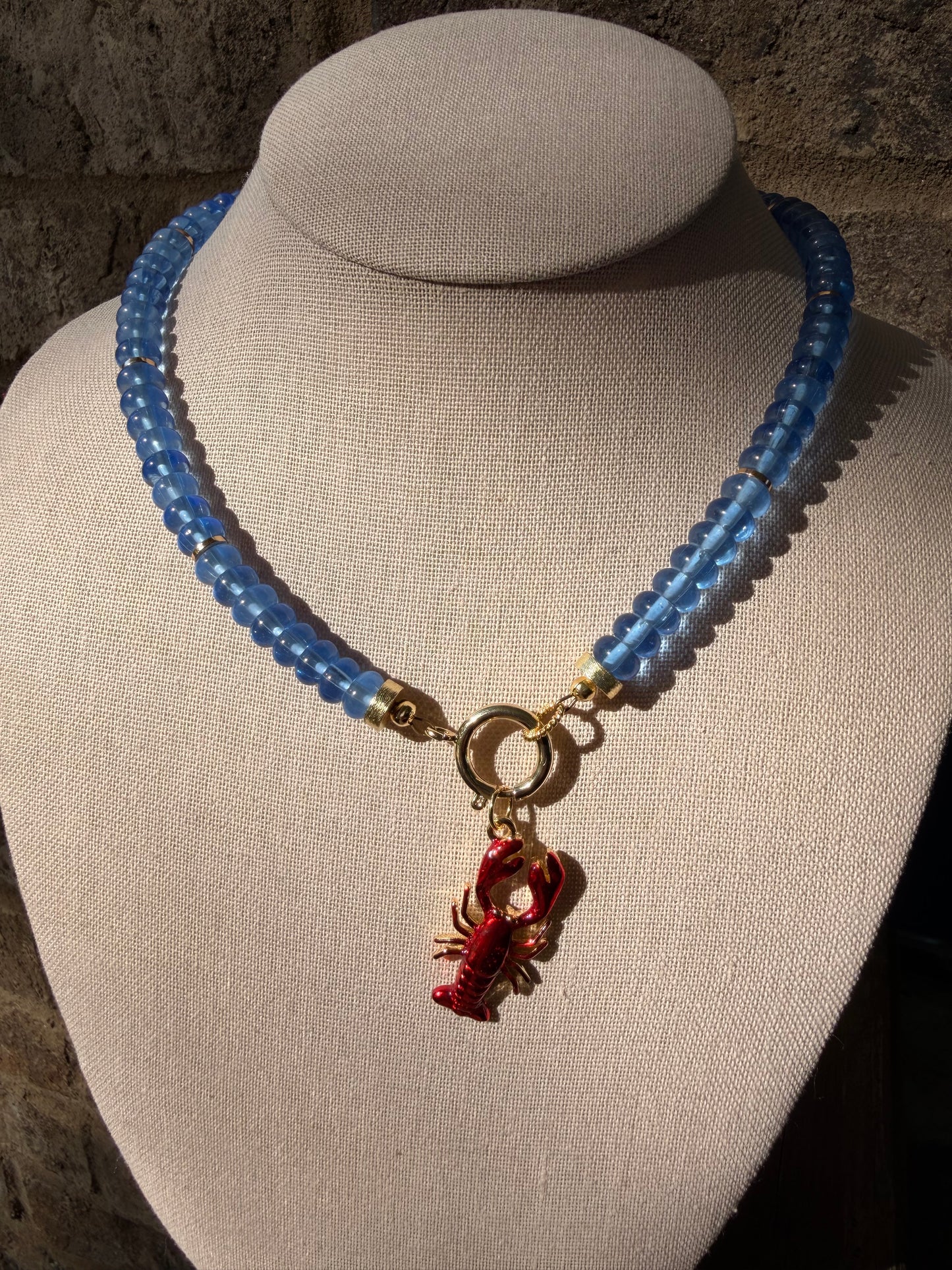American: blue rondelle beads with a removable lobster charm