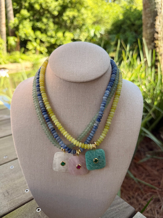 Flock: saucer beads with a square pendant