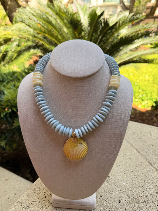 Beachy: light blue recycled glass beads with a yellow shell pendant