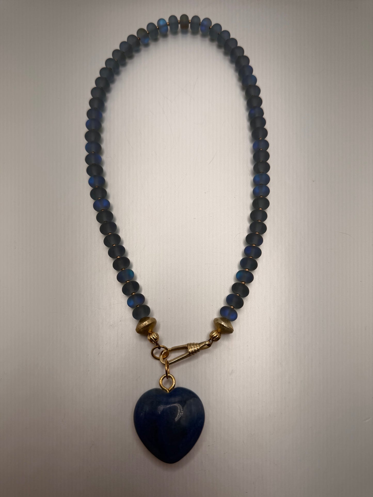 Flock: Frosty blue iridescent beads with a blue heart pendant
