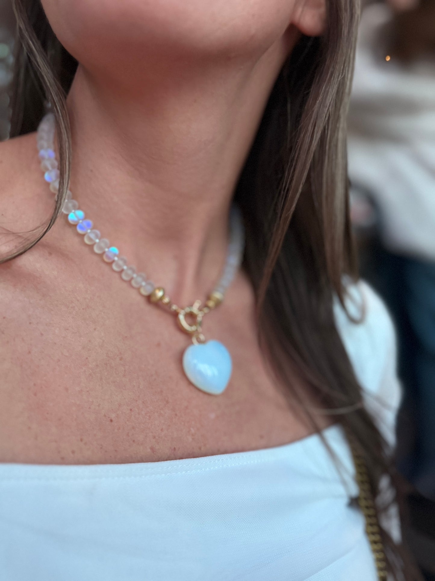 Flock: Frosty white iridescent beads with a matching heart pendant
