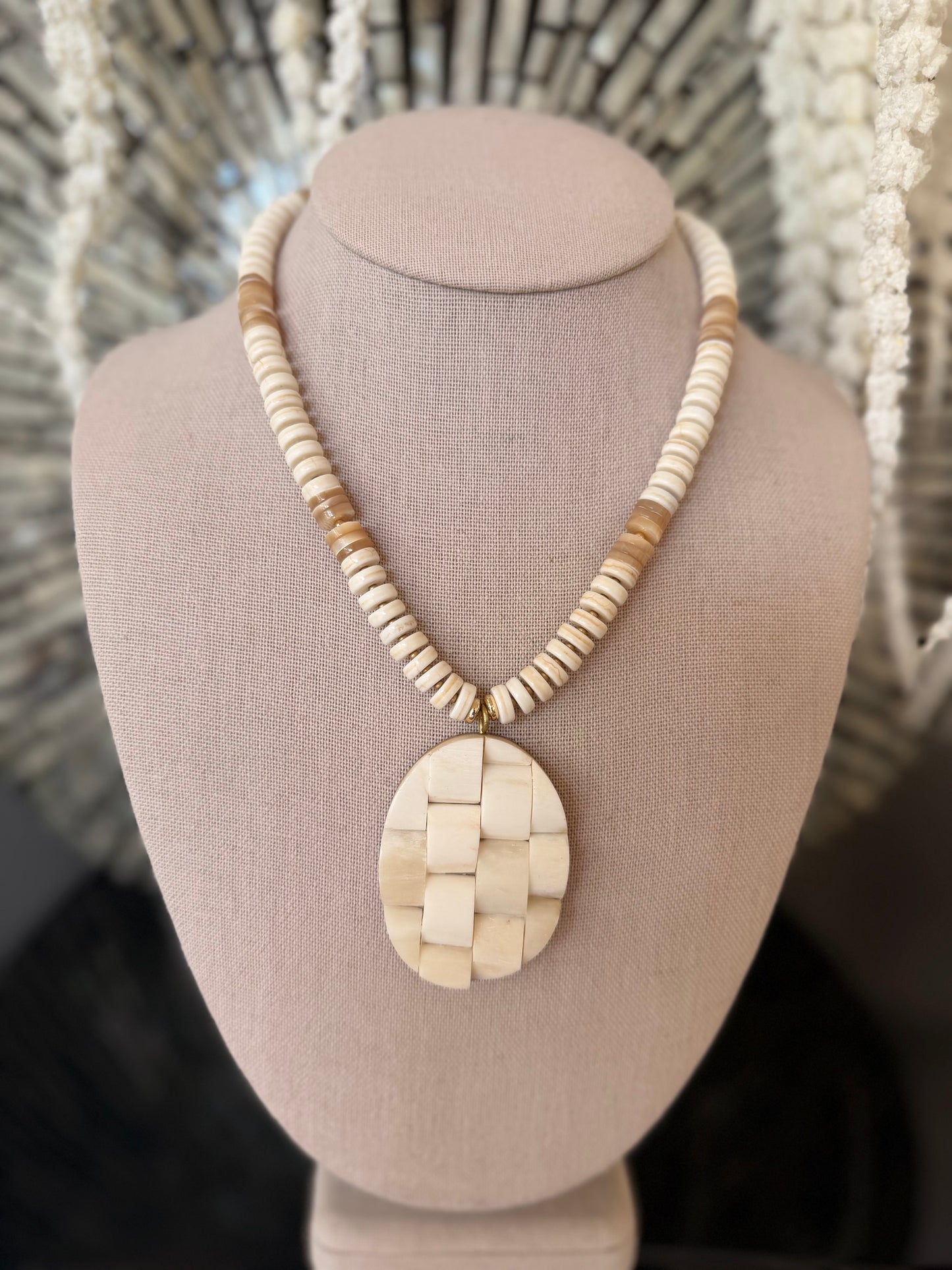 Beachy: cream and shells with a woven textured pendant