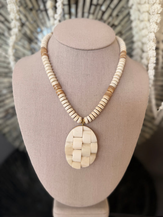 Beachy: cream and shells with a woven textured pendant