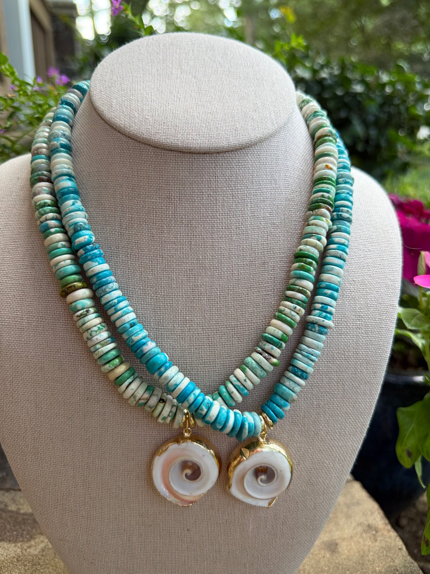 Beachy: turquoise or green with a shell pendant
