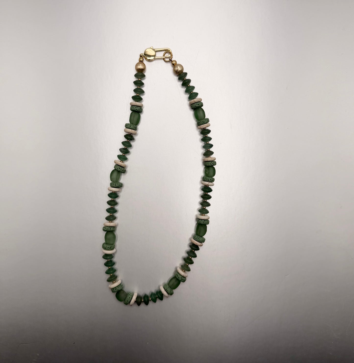 Flock: Green saucer beads with lava and glass beads