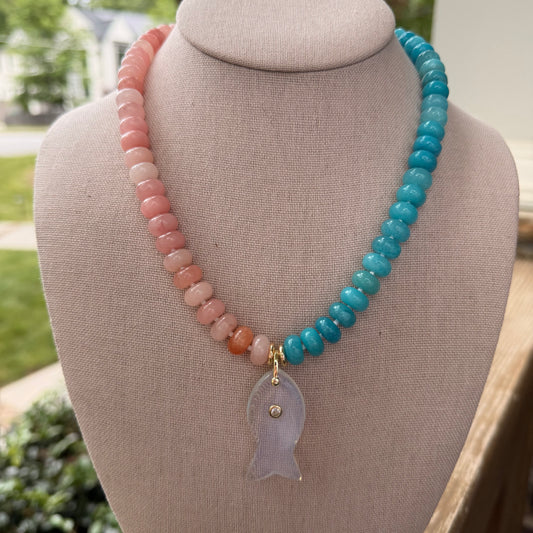 Flock: half aqua half pink with a fish pendant