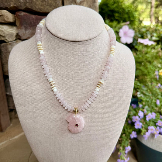 Beachy: light pink saucer beads with shells and a light pink nautilus shell pendant