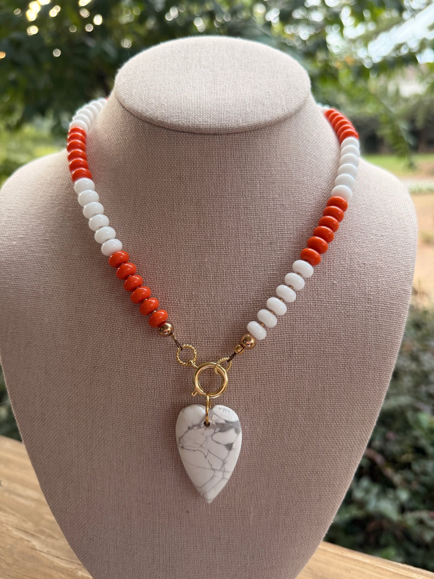 Game Day🏈: Orange and white with a white heart pendant
