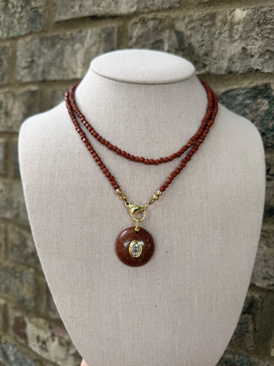 Double wrap: dark rust red with a sparkly pendant