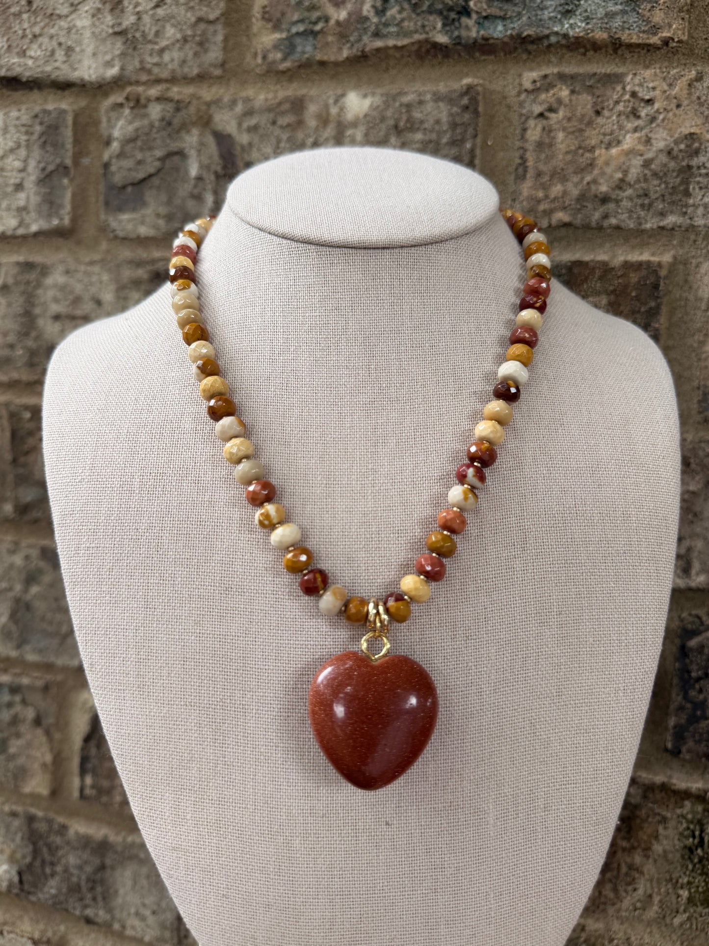 Flock: amber and brown with a sparkly bronze heart pendant