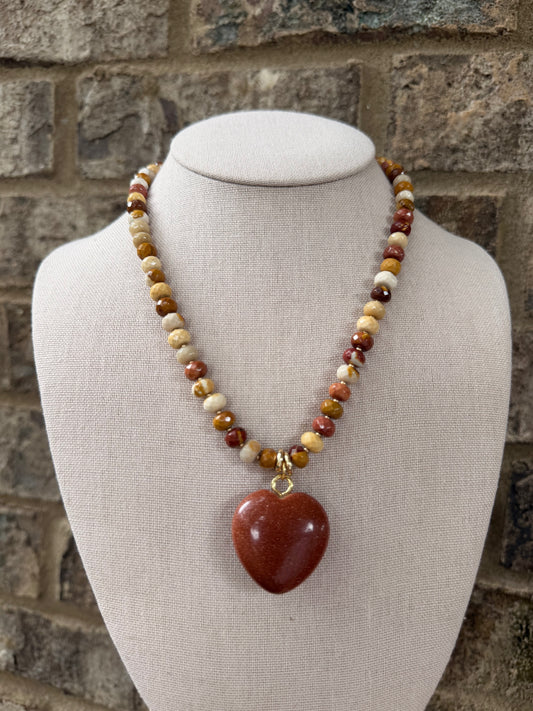 Flock: amber and brown with a sparkly bronze heart pendant