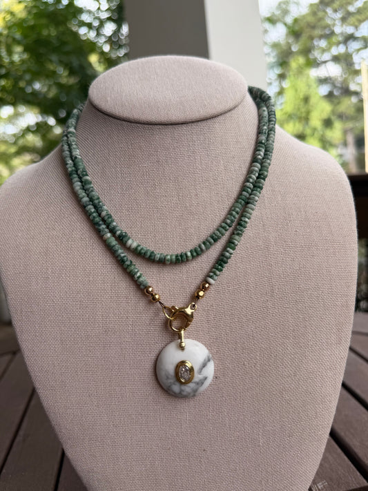 Double wrap: green and white beads with a round, white pendant