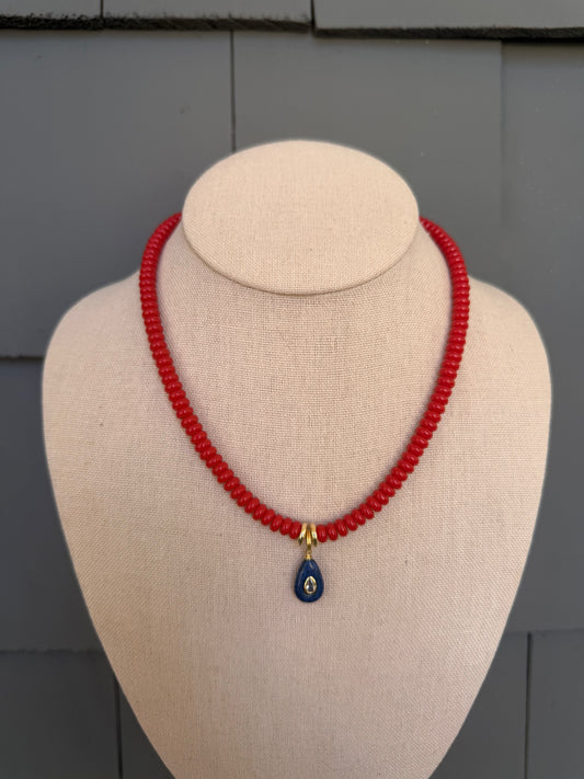 American: 6mm beaded red with small blue pendant