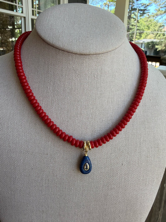 American: 6mm beaded red with small blue pendant