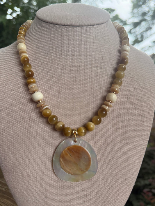 Beachy: Carmel colored beads with shell pendant